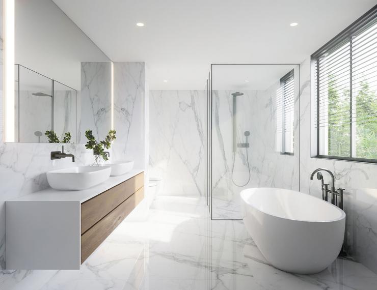 Salle de bain lumineuse avec baignoire, douche vitrée et meuble vasque